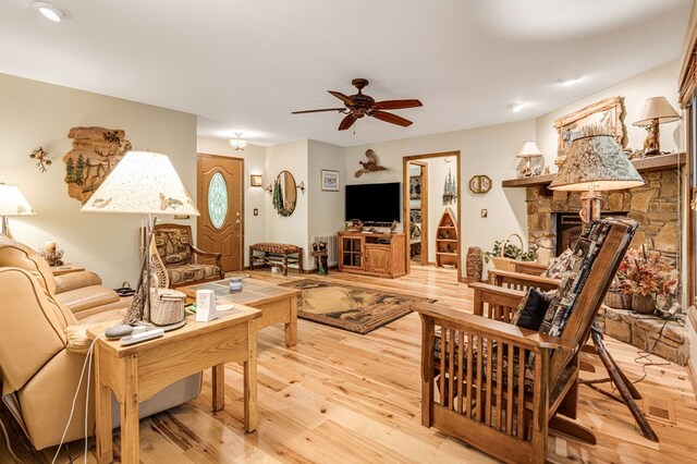 177 Lake Dr, Topton, NC 28781 - living area with a ceiling fan, light wood-style floors, and a fireplace