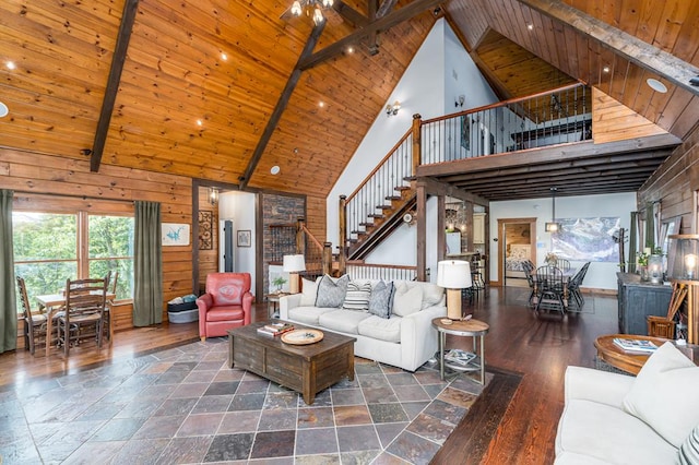 1363 NE Foxhound Trl, Ranger, GA 30734 - living area featuring high vaulted ceiling, stairway, wood finished floors, and wooden ceiling with exposed beams