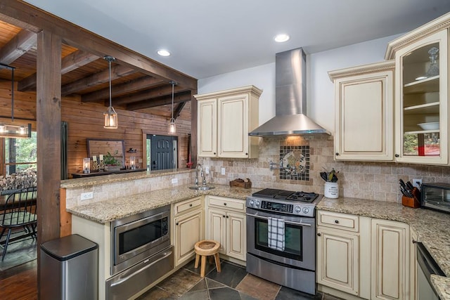 1363 NE Foxhound Trl, Ranger, GA 30734 - kitchen featuring cream cabinets, wall chimney range hood, stainless steel appliances, wood walls, and wooden ceiling with exposed beams