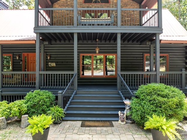 1363 NE Foxhound Trl, Ranger, GA 30734 - entrance to property with a balcony, covered porch, and metal roof