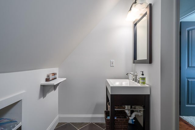 1363 NE Foxhound Trl, Ranger, GA 30734 - bathroom with vanity, baseboards, and vaulted ceiling
