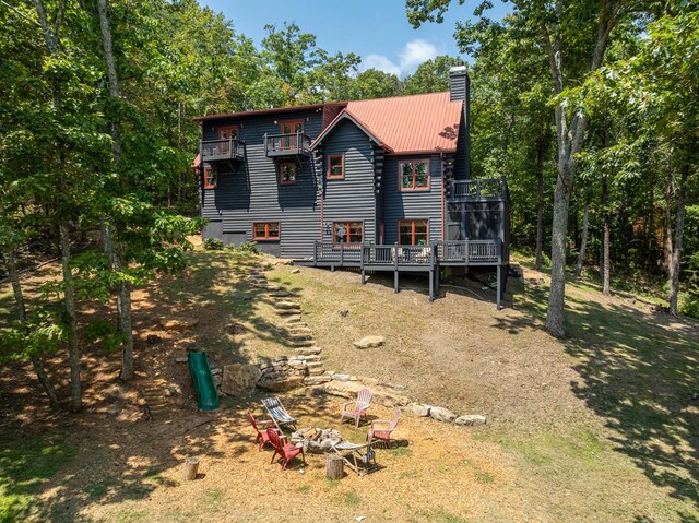 back of house featuring a deck