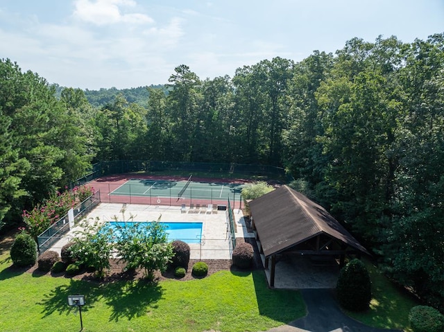 1363 NE Foxhound Trl, Ranger, GA 30734 - view from above of property with a heavily wooded area and a pool area