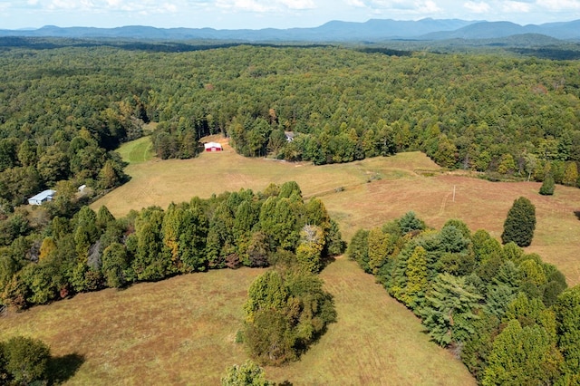 aerial view with a mountain view and a view of trees