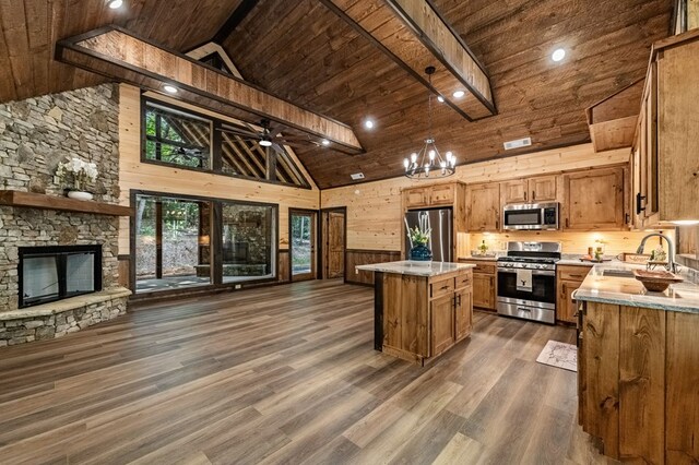 interior space with wood walls, high vaulted ceiling, dark wood-type flooring, and wood ceiling