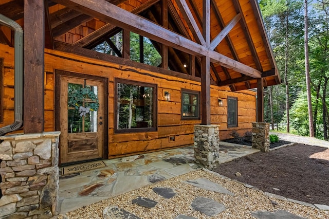 doorway to property with a patio