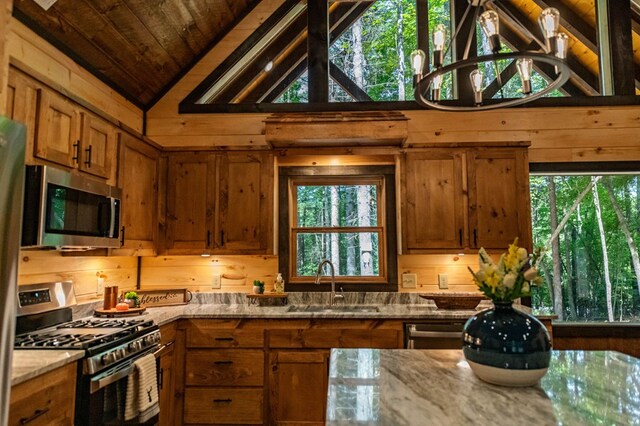 bathroom with wooden walls, vanity, and hardwood / wood-style flooring