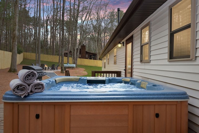 exterior space featuring a hot tub