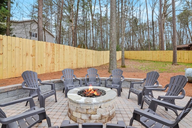 view of patio / terrace featuring an outdoor fire pit