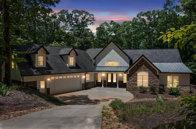 705 Brown Deer Dr, Talking Rock, GA 30175 - view of front of house featuring french doors, stone siding, an attached garage, a standing seam roof, and concrete driveway