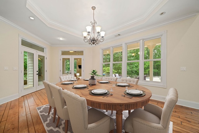 705 Brown Deer Dr, Talking Rock, GA 30175 - dining space with french doors, a chandelier, light wood-style flooring, a tray ceiling, and ornamental molding