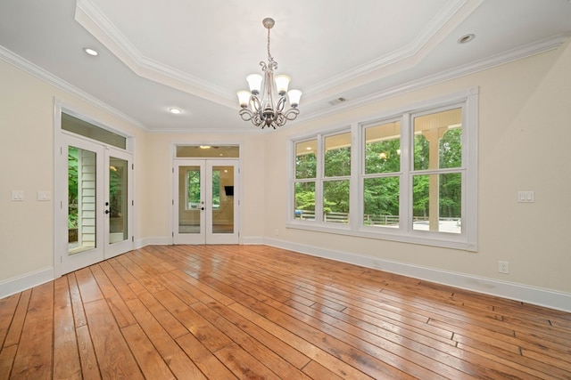 705 Brown Deer Dr, Talking Rock, GA 30175 - empty room with french doors, light wood-style floors, a chandelier, ornamental molding, and a raised ceiling