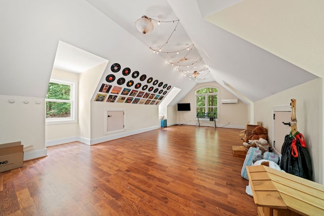 705 Brown Deer Dr, Talking Rock, GA 30175 - additional living space with lofted ceiling, wood finished floors, and an AC wall unit