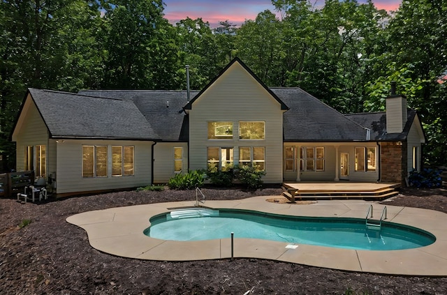 705 Brown Deer Dr, Talking Rock, GA 30175 - rear view of house featuring a chimney, a wooden deck, an outdoor pool, a shingled roof, and a patio
