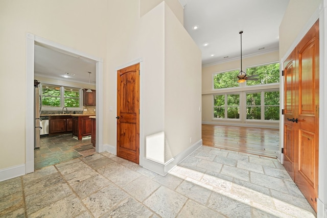705 Brown Deer Dr, Talking Rock, GA 30175 - hall featuring stone tile floors, ornamental molding, and recessed lighting
