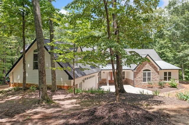 705 Brown Deer Dr, Talking Rock, GA 30175 - view of side of home featuring driveway, stone siding, and a shingled roof
