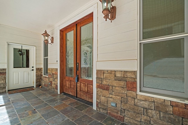 705 Brown Deer Dr, Talking Rock, GA 30175 - property entrance with stone siding, french doors, and covered porch