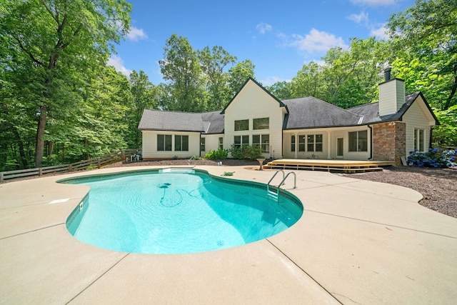 705 Brown Deer Dr, Talking Rock, GA 30175 - outdoor pool featuring a wooden deck, a patio area, and view of scattered trees