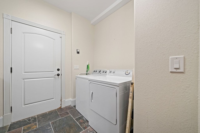 705 Brown Deer Dr, Talking Rock, GA 30175 - washroom featuring stone tile floors, washing machine and dryer, and a textured wall