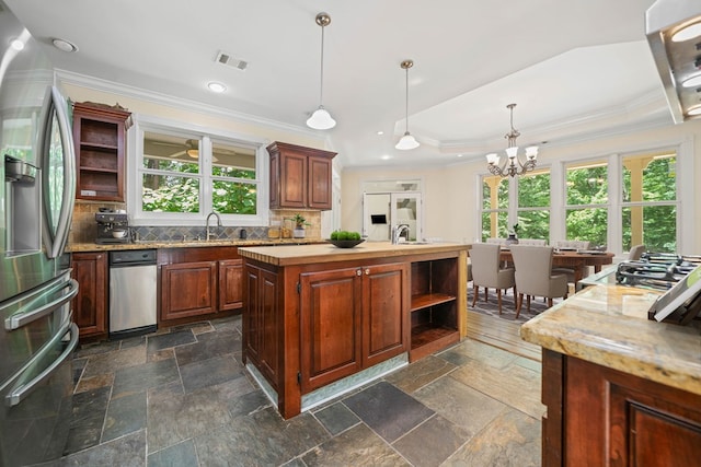 705 Brown Deer Dr, Talking Rock, GA 30175 - kitchen featuring stainless steel appliances, open shelves, a chandelier, crown molding, and decorative backsplash