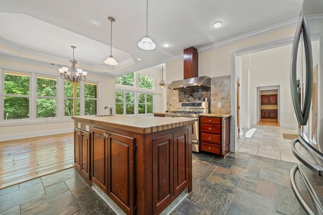 705 Brown Deer Dr, Talking Rock, GA 30175 - kitchen with stainless steel appliances, stone tile floors, ornamental molding, wall chimney exhaust hood, and wooden counters