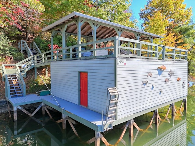 exterior space featuring boat lift and stairway