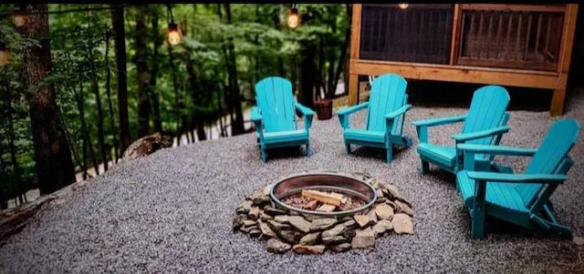 view of patio featuring an outdoor fire pit