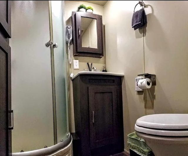 bathroom with toilet and vanity