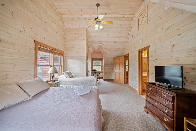 carpeted bedroom with wood ceiling, vaulted ceiling, wooden walls, connected bathroom, and ceiling fan