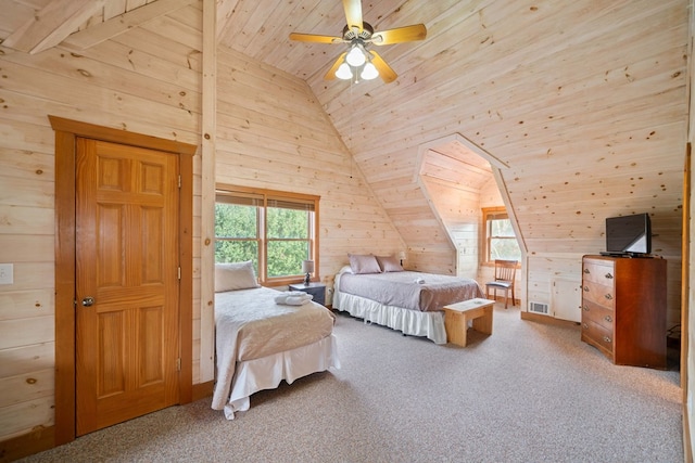 bedroom with multiple windows, wooden walls, and carpet