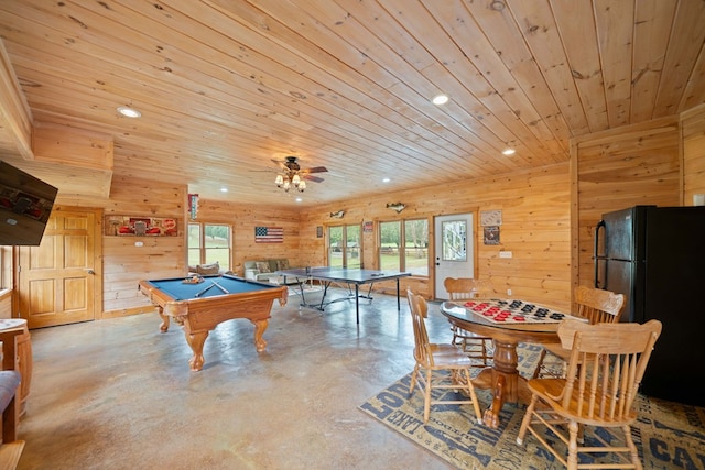 playroom with a wealth of natural light, wood ceiling, and wooden walls