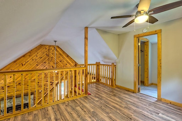 bonus room with hardwood / wood-style floors, ceiling fan, and vaulted ceiling