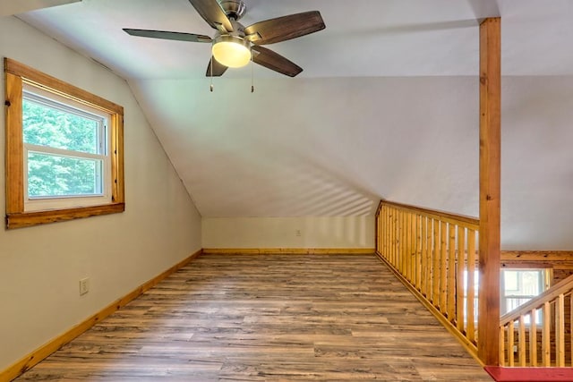 bonus room with hardwood / wood-style flooring, ceiling fan, and lofted ceiling