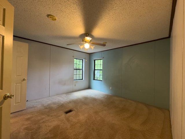1146 Marrestop Rd, Murphy, NC 28906 - unfurnished room featuring crown molding, ceiling fan, carpet, a textured ceiling, and a decorative wall