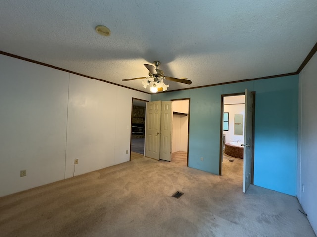 1146 Marrestop Rd, Murphy, NC 28906 - unfurnished bedroom with ornamental molding, light colored carpet, a textured ceiling, ensuite bathroom, and ceiling fan