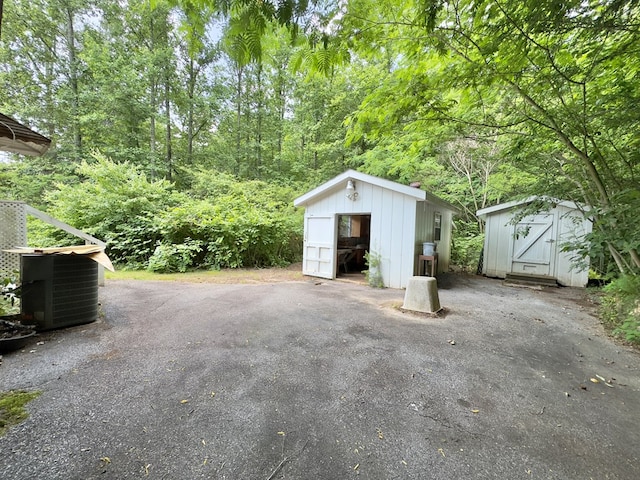 1146 Marrestop Rd, Murphy, NC 28906 - garage featuring a storage shed and central AC