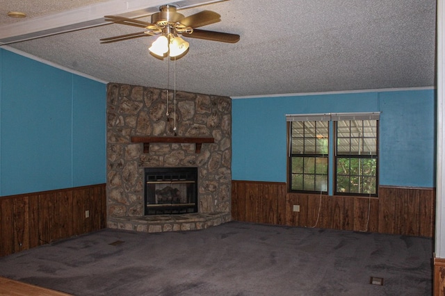 1146 Marrestop Rd, Murphy, NC 28906 - unfurnished living room with a textured ceiling, a wainscoted wall, a fireplace, ornamental molding, and ceiling fan