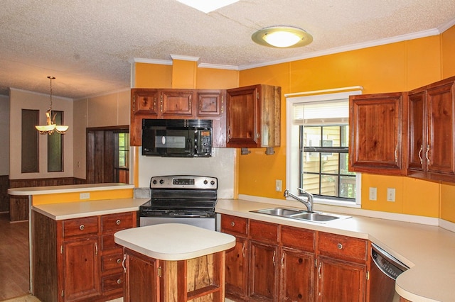 1146 Marrestop Rd, Murphy, NC 28906 - kitchen featuring appliances with stainless steel finishes, a sink, a textured ceiling, light countertops, and a peninsula