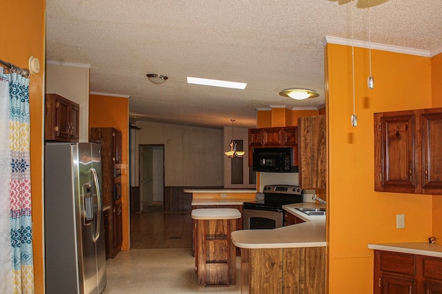 1146 Marrestop Rd, Murphy, NC 28906 - kitchen with stainless steel appliances, a sink, light countertops, crown molding, and a peninsula