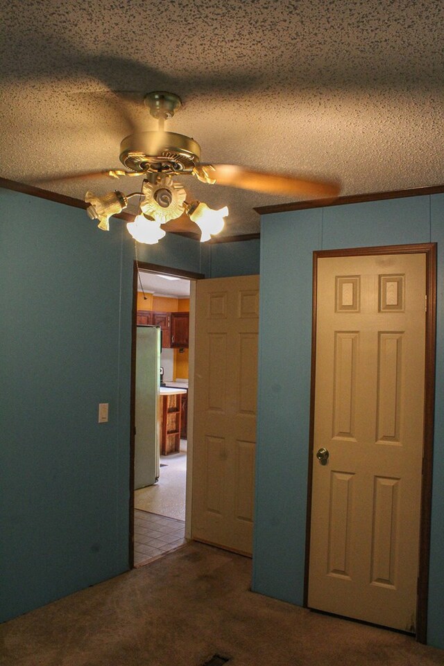 1146 Marrestop Rd, Murphy, NC 28906 - unfurnished bedroom featuring freestanding refrigerator, carpet, ornamental molding, and a ceiling fan