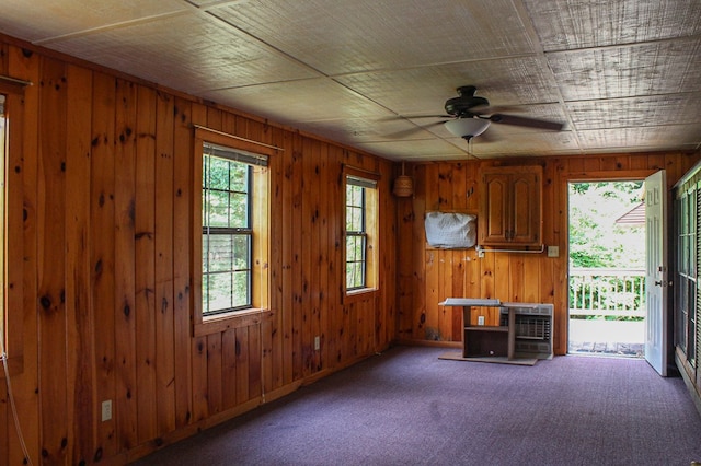 1146 Marrestop Rd, Murphy, NC 28906 - carpeted spare room featuring a ceiling fan and wood walls