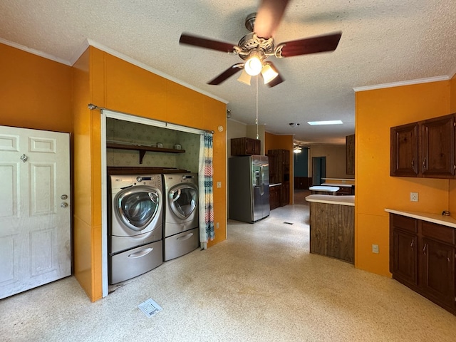 1146 Marrestop Rd, Murphy, NC 28906 - laundry room featuring separate washer and dryer, ornamental molding, a ceiling fan, and a textured ceiling