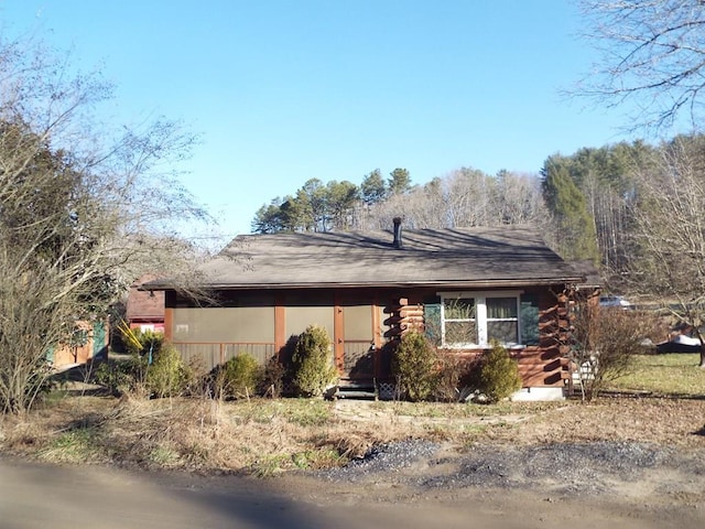 cabin featuring log exterior