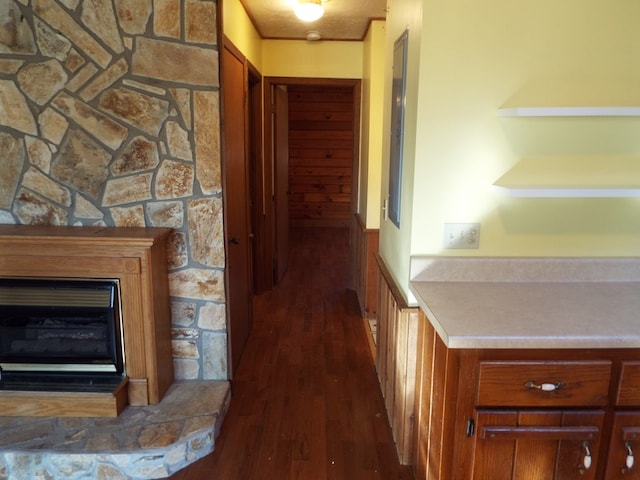 corridor with dark wood-style flooring