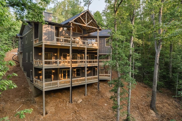 back of house featuring a balcony