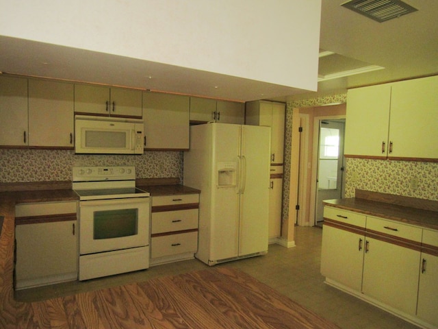 138 Brittain Trce, Andrews, NC 28901 - kitchen with white appliances, dark countertops, and wallpapered walls