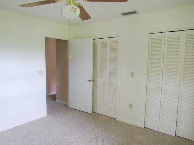 138 Brittain Trce, Andrews, NC 28901 - unfurnished bedroom with two closets, light colored carpet, baseboards, and ceiling fan