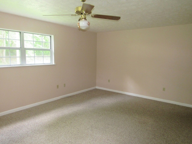 138 Brittain Trce, Andrews, NC 28901 - unfurnished room featuring carpet floors, a ceiling fan, baseboards, and a textured ceiling