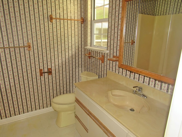 138 Brittain Trce, Andrews, NC 28901 - bathroom featuring toilet, wallpapered walls, baseboards, and vanity