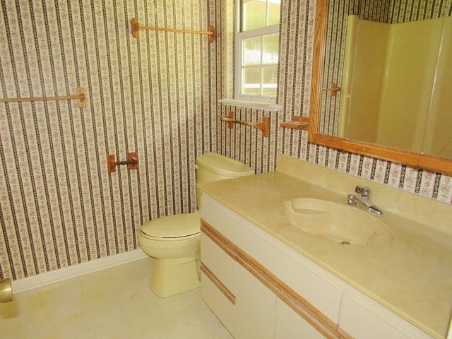 138 Brittain Trce, Andrews, NC 28901 - bathroom with wallpapered walls, toilet, vanity, and baseboards